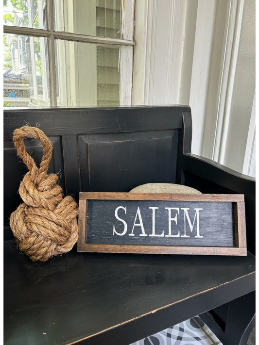 Odd Cod Studio's Crown and Wall door stop and hand-painted wooden Salem sign in Anchor Black with Sea Salt lettering
